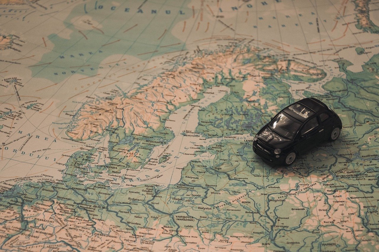 car on a map showing Norway